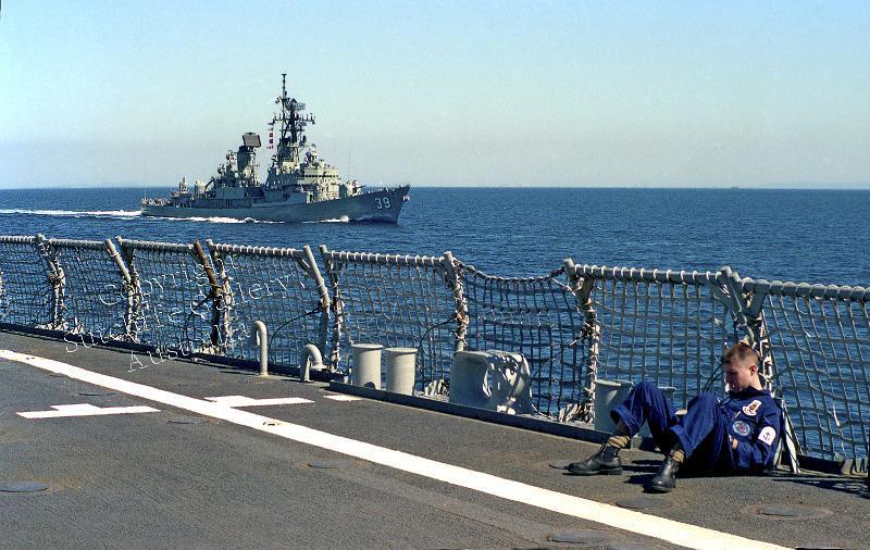 MC11.jpg - Guided missile destroyer HMAS Hobart (now a dive wreck off South Australia) from the flight deck of HMAS Kanimbla. (Looks like someone has some time off duty?)