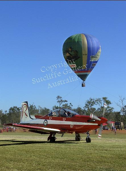 AC18.jpg - An RAAF Roulettes plane taxies out for another demonstraion with the defence forces hot air balloon behind.