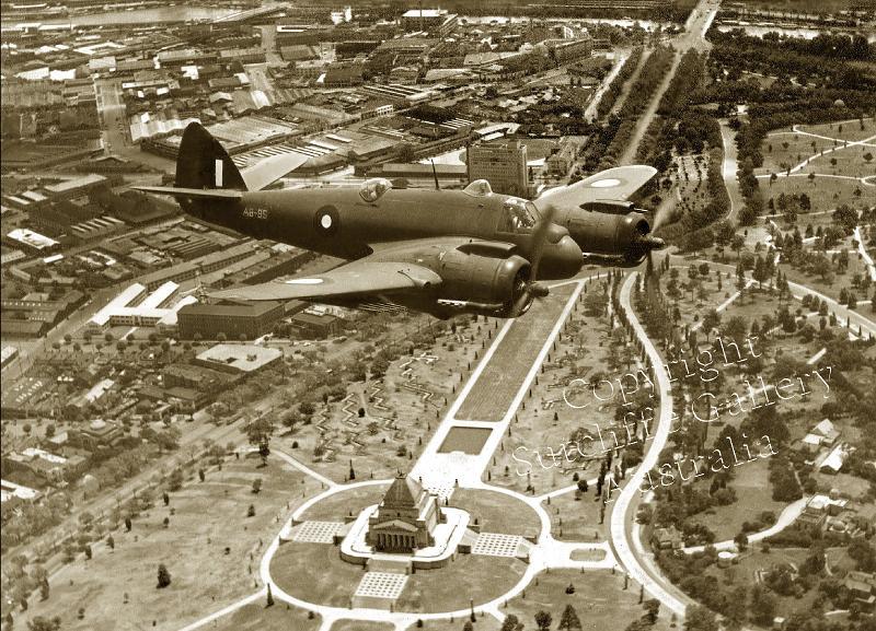 AC23.jpg - A Bristol Beaufighter over the Shrine of Rememberance in Melbourne, 1944. Great shot with air raid trenches in the parks visible. Not available in colour.