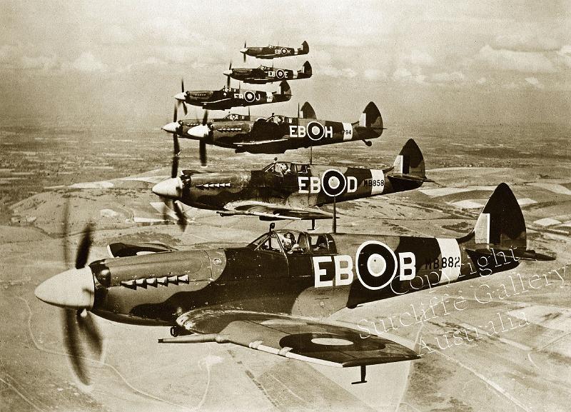 AC25.jpg - Fantastic group shot of these fine Spitfire Mk.XIIs on patrol along the coast of England in WWII. Not available in colour. Larger sizes available.