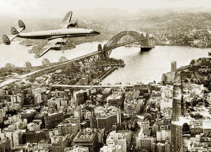 AC40.jpg - Great view of the centre of Sydney with the first of Qantas' new Constellations arriving. Not available in colour.