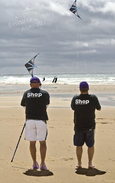 PC08.jpg - Two lads hard at work with their synchronised aerobatic kites.
