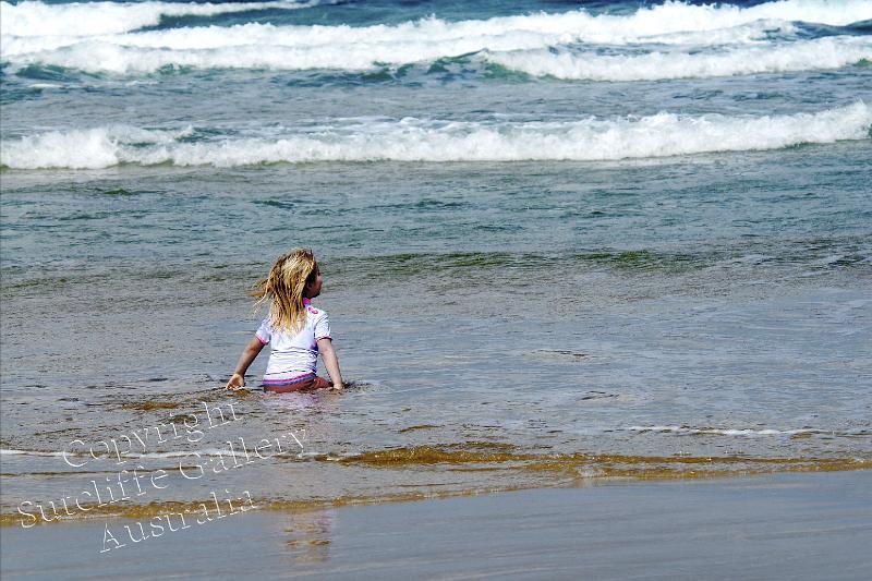 PC11.jpg - The sheer delight of this young girl in the shallows of the beach makes a smile easy to accept.